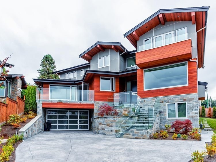 gray and red house with glass garage
