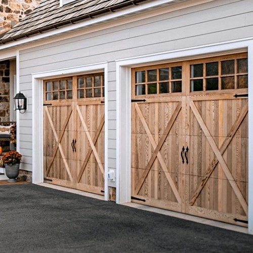 Black overlay carriage house garage door