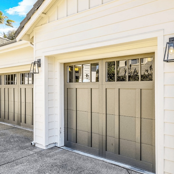 Black overlay carriage house garage door