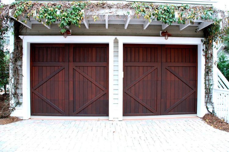 New cherry wood garage doors with white finish on two-car residential garage