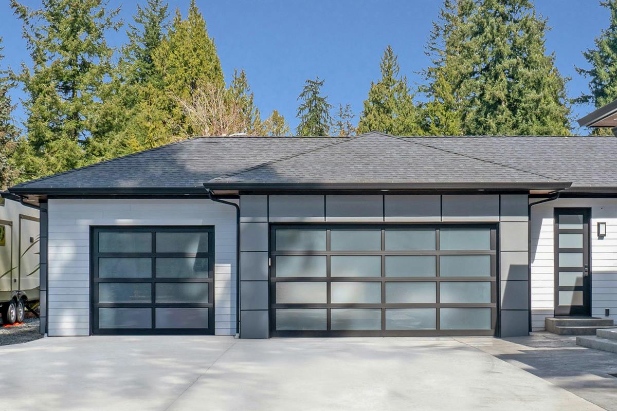 Three-car garage with full-view aluminum garage doors
