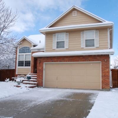 Colorado home garage in sun, snow, and hail conditions
