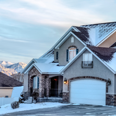 Before and after comparison of an older and newer garage door improving curb appeal