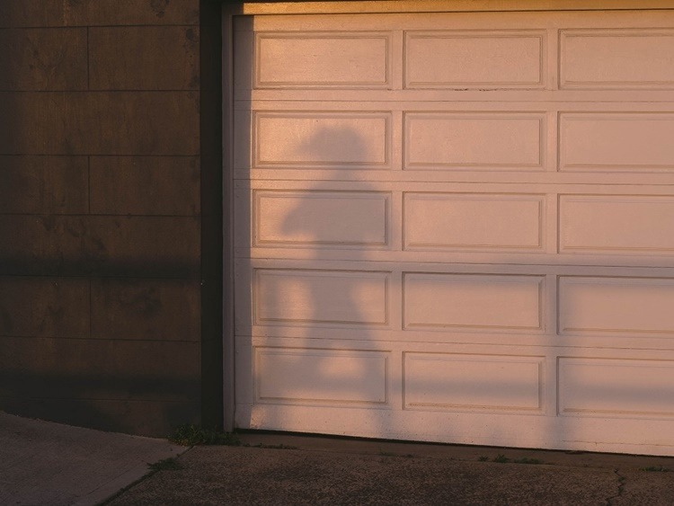 white garage door with silhouette
