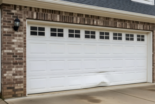 Damaged garage door with weakened panels