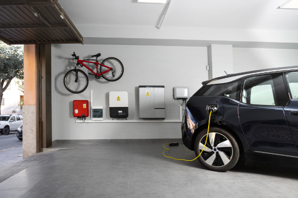 EV charging cable routed safely away from garage door tracks and opener
