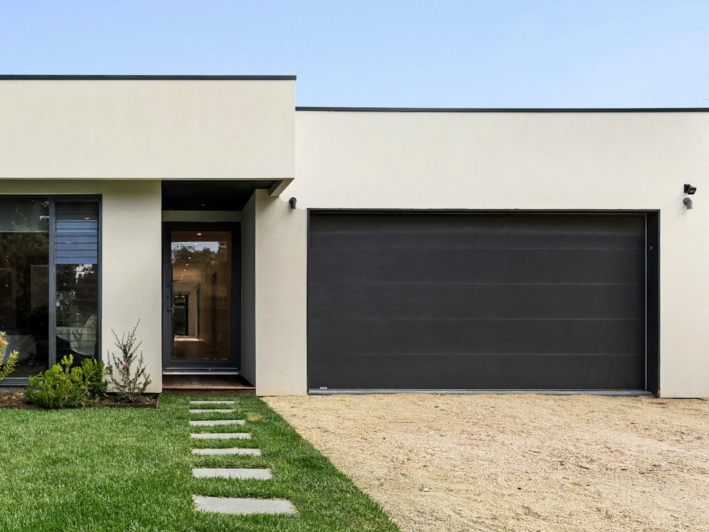 Durable steel overhead garage door on residential property