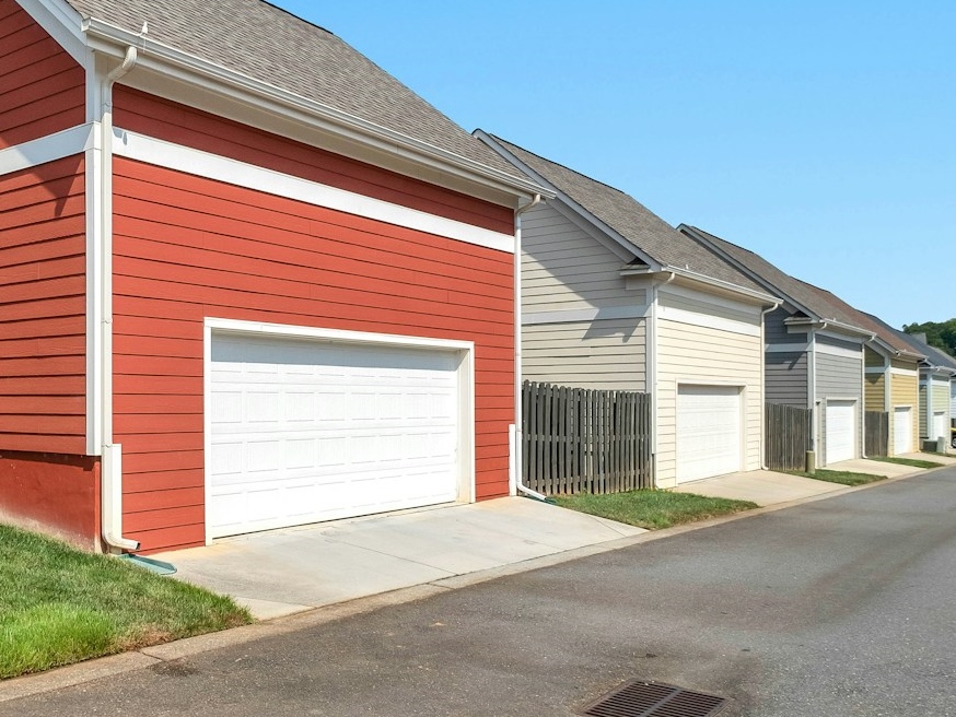 Neighboring prefabrictaed garages in assorted colors