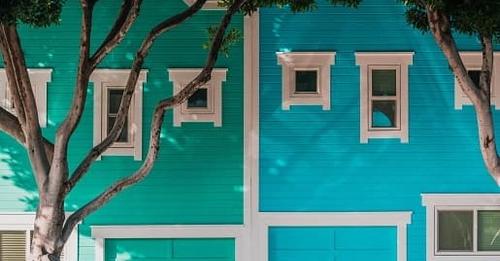 green and blue houses with matching garage colors