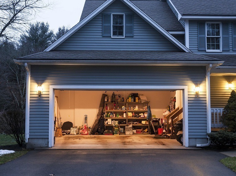 blue house with illuminated garage