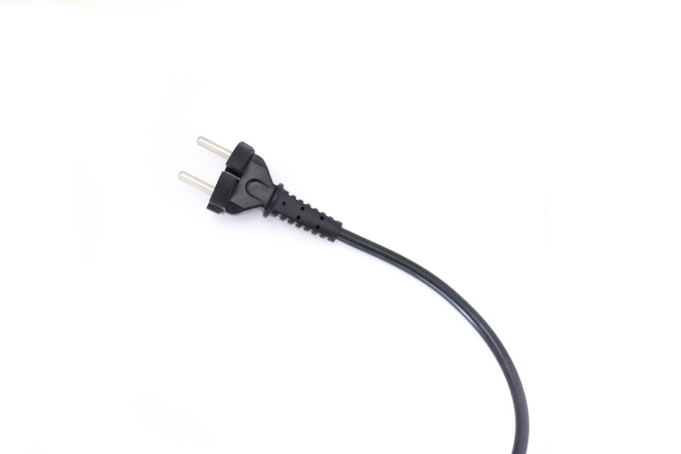 Unplugged black electrical cord pictured against white background