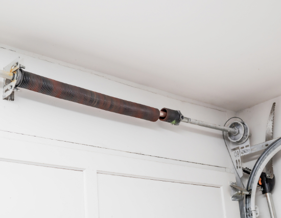 Broken garage door torsion spring on the shaft